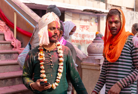 BARSANA, UTTAR PRADESH / INDIA - MARCH 2020: People celebrate the traditional and a ritualistic...