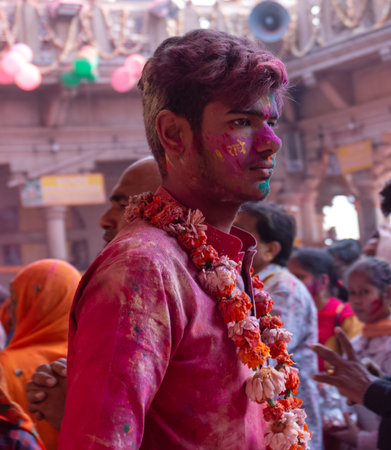 BARSANA, UTTAR PRADESH / INDIA - MARCH 2020: People celebrate the traditional and a ritualistic...