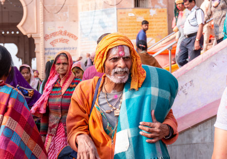 BARSANA, UTTAR PRADESH / INDIA - MARCH 2020: People celebrate the traditional and a ritualistic colorful Lathmar Holi with dance and colored faces at Radharani templeのeditorial素材