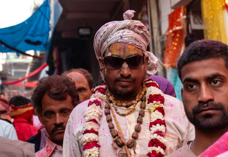 BARSANA, UTTAR PRADESH / INDIA - MARCH 2020: People celebrate the traditional and a ritualistic colorful Lathmar Holi with dance and colored faces at Radharani templeのeditorial素材