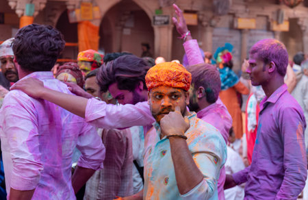 BARSANA, UTTAR PRADESH / INDIA - MARCH 2020: People celebrate the traditional and a ritualistic...