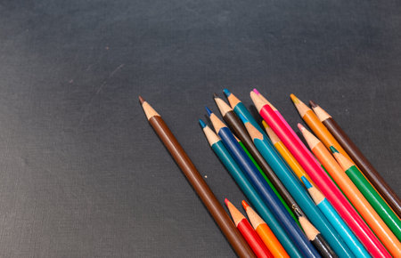 Multi color pencils isolated on black background. Close up shot.の写真素材