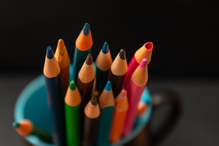 Multi color pencils isolated on black background. Close up shot.の写真素材