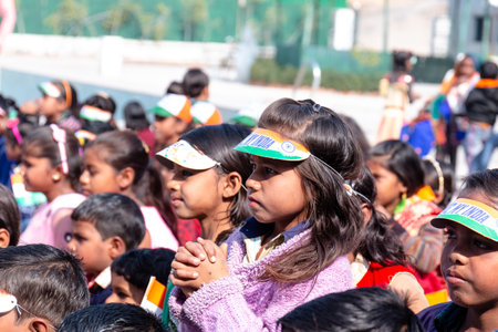NOIDA, UTTAR PRADESH, INDIA - JANUARY 2020 : Young Indian students from Slum or Village area celebrating Indian Republic Day function at school with Indian National flag in hand.のeditorial素材