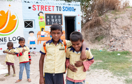 Noida, Uttar Pradesh, India - September 2019 : Poor Students from rural or slum area educated at schools with school bags. spreading happiness on their cute facesのeditorial素材