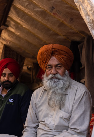 NEW DELHI, INDIA - JANUARY 2021 : Portrait of Old Sikh Indian farmers from different states protests...