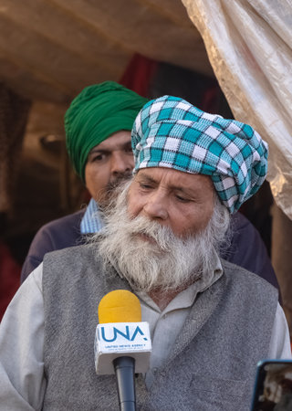 NEW DELHI, INDIA - JANUARY 2021 : Portrait of Old Sikh Indian farmers from different states protests at Ghazipur Border. Farmers are protesting against the new farm laws in India.のeditorial素材