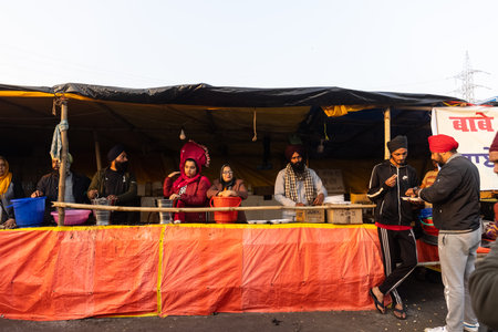 GHAZIABAD, UTTAR PRADESH, INDIA - JANUARY 2021 : Indian Sikh farmers protesting against the new farm bill laws at Ghazipur border near Delhi. Farmers across India protesting against the farm bill.のeditorial素材