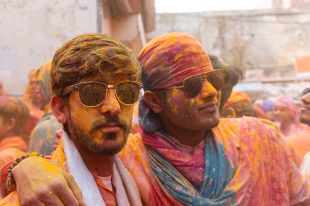 BARSANA, UTTAR PRADESH, INDIA - MARCH 2020 : Unidentified people from Nandgaon visits Barsana to play colorful Holi with the Women of Barsana as ritual of Lathmar holi every year.のeditorial素材