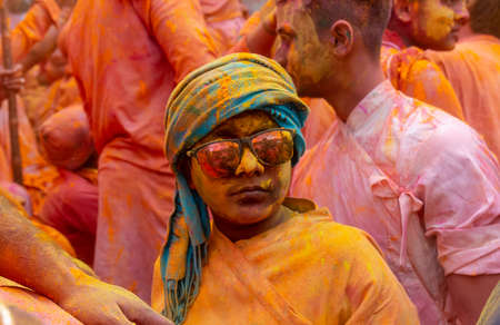 BARSANA, UTTAR PRADESH, INDIA - MARCH 2020 : Unidentified people from Nandgaon visits Barsana to play colorful Holi with the Women of Barsana as ritual of Lathmar holi every year.のeditorial素材