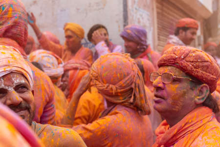 BARSANA, UTTAR PRADESH, INDIA - MARCH 2020 : Unidentified people from Nandgaon visits Barsana to play colorful Holi with the Women of Barsana as ritual of Lathmar holi every year.のeditorial素材