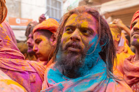 BARSANA, UTTAR PRADESH, INDIA - MARCH 2020 : Unidentified people from Nandgaon visits Barsana to play colorful Holi with the Women of Barsana as ritual of Lathmar holi every year.のeditorial素材