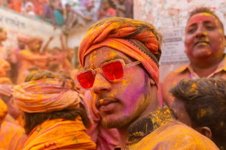 BARSANA, UTTAR PRADESH, INDIA - MARCH 2020 : Unidentified people from Nandgaon visits Barsana to play colorful Holi with the Women of Barsana as ritual of Lathmar holi every year.のeditorial素材