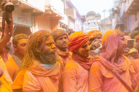 BARSANA, UTTAR PRADESH, INDIA - MARCH 2020 : Unidentified people from Nandgaon visits Barsana to play colorful Holi with the Women of Barsana as ritual of Lathmar holi every year.のeditorial素材