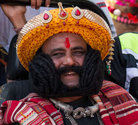 Bikaner, Rajasthan, India - January 2019 : Portrait of Rajput male  from bikaner city with big mustache, beard and colorful turban in traditional attire and necklace participating in camel festival.のeditorial素材