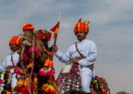 Bikaner, Rajasthan, India - January 2019 : Portrait of Rajput male  from bikaner city with big mustache, beard and colorful turban in traditional attire and necklace participating in camel festival.のeditorial素材