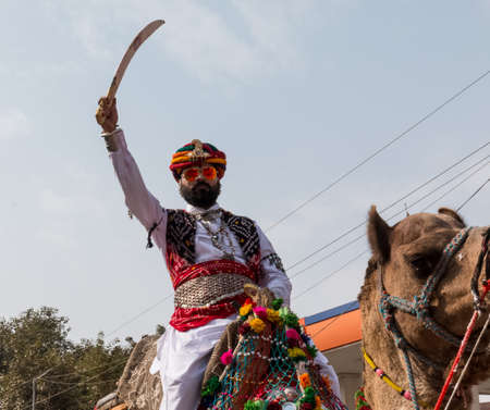 Bikaner, Rajasthan, India - January 2019 : Portrait of Rajput male  from bikaner city with big mustache, beard and colorful turban in traditional attire and necklace participating in camel festival.のeditorial素材