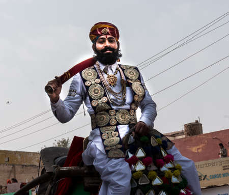 Bikaner, Rajasthan, India - January 2019 : Portrait of Rajput male  from bikaner city with big mustache, beard and colorful turban in traditional attire and necklace participating in camel festival.のeditorial素材