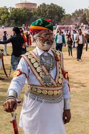 Bikaner, Rajasthan, India - January 2019 : Portrait of Rajput male  from bikaner city with big mustache, beard and colorful turban in traditional attire and necklace participating in camel festival.のeditorial素材