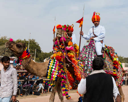 Bikaner, Rajasthan, India - January 2019 : Portrait of Rajput male  from bikaner city with big mustache, beard and colorful turban in traditional attire and necklace participating in camel festival.のeditorial素材