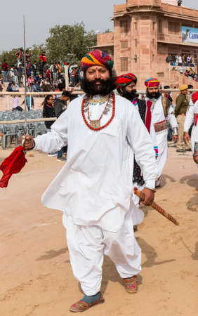 Bikaner, Rajasthan, India - January 2019 : Portrait of Rajput male  from bikaner city with big mustache, beard and colorful turban in traditional attire and necklace participating in camel festival.のeditorial素材