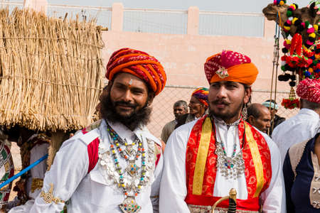 Bikaner, Rajasthan, India - January 2019 : Portrait of Rajput male  from bikaner city with big mustache, beard and colorful turban in traditional attire and necklace participating in camel festival.のeditorial素材