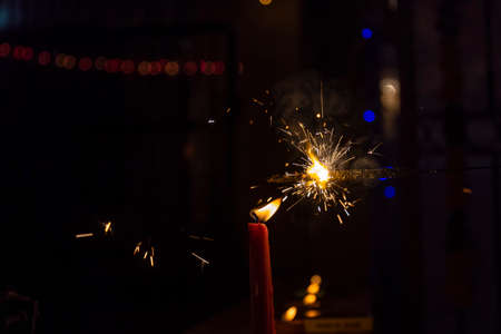 Sparkler or Fuljhadi in hand with dark black background to celebrate the festival of Diwali.の写真素材