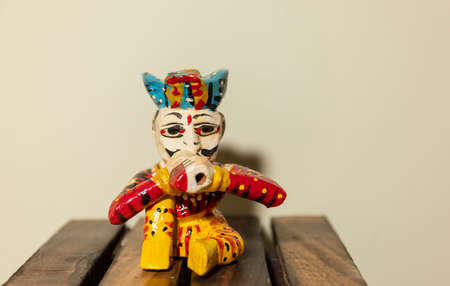 Handmade colorful wooden rajasthani musician souvenir with plain background.の写真素材