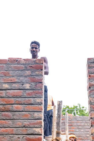 Jawai, Rajasthan, India - September 2021: Indian Labour, Portrait of male labor working at newly...