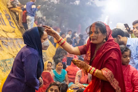 Ghaziabad, Uttar Pradesh, India - November 2021: Chhath Puja, Indian hindu devotees performing...
