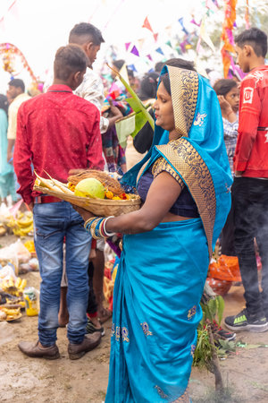 Ghaziabad, Uttar Pradesh, India - November 2021: Chhath Puja, Indian hindu devotees performing...