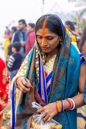 Ghaziabad, Uttar Pradesh, India - November 2021: Chhath Puja, Indian hindu devotees performing...