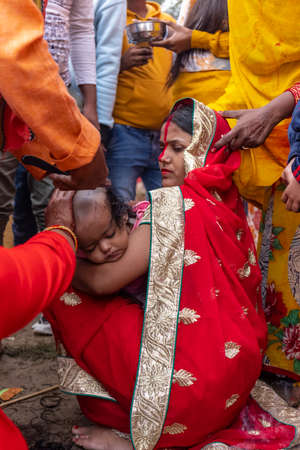 Ghaziabad, Uttar Pradesh, India - November 2021: Chhath Puja, Indian hindu devotees performing...