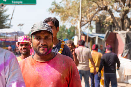 Barsana, Uttar Pradesh, India - March 2022: Portrait on Indian people with color on face celebrating the colorful holi festival on the streets of barsana.のeditorial素材