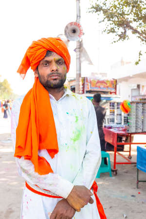Barsana, Uttar Pradesh, India - March 2022: Portrait on Indian people with color on face celebrating...
