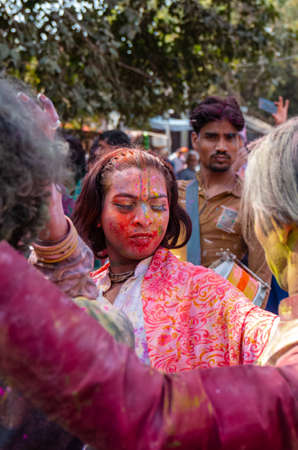 Barsana, Uttar Pradesh, India - March 2022: Portrait on Indian people with color on face celebrating the colorful holi festival on the streets of barsana.のeditorial素材