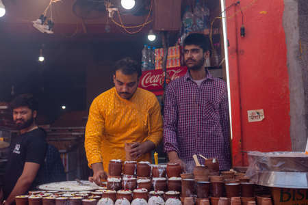 Barsana, Uttar Pradesh, India - March 2022: Portrait on Indian people with color on face celebrating the colorful holi festival on the streets of barsana.のeditorial素材