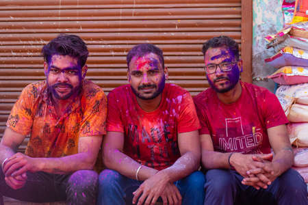 Barsana, Uttar Pradesh, India - March 2022: Portrait on Indian people with color on face celebrating...