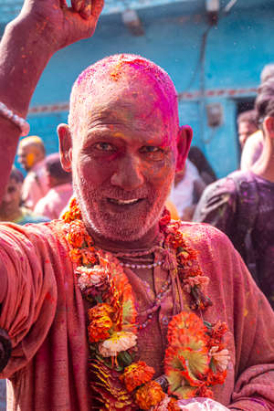 Barsana, Uttar Pradesh, India - March 2022: Portrait on Indian people with color on face celebrating...