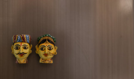 Wooden dolls on the wall in the interior of the store.の写真素材
