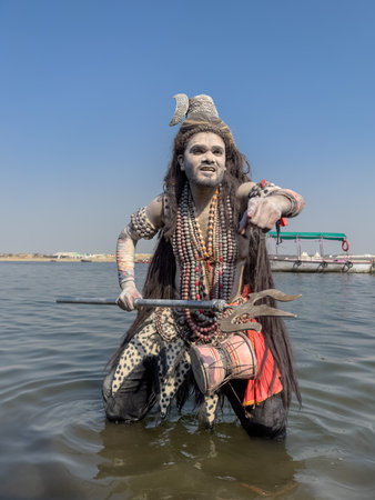 Varanasi, Uttar Pradesh, India - March 2023: Masan Holi, Portrait of an male artist with painted face act as lord shiva during the celebration of masaan holi at harishchandra ghat.のeditorial素材