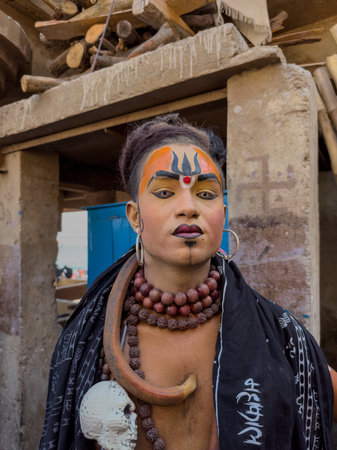 Varanasi, Uttar Pradesh, India - March 2023: Masan Holi, Portrait of an male artist with painted face act as lord shiva during the celebration of masaan holi at harishchandra ghat.のeditorial素材