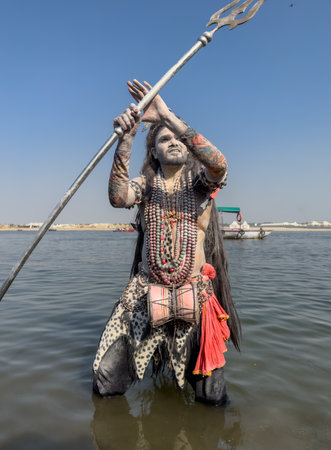 Varanasi, Uttar Pradesh, India - March 2023: Masan Holi, Portrait of an male artist with painted face act as lord shiva during the celebration of masaan holi at harishchandra ghat.のeditorial素材
