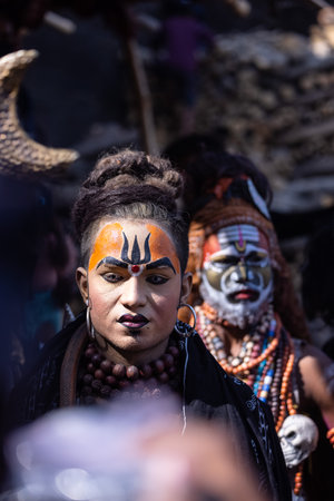 Varanasi, Uttar Pradesh, India - March 2023: Masan Holi, Portrait of an male artist with painted face act as lord shiva during the celebration of masaan holi at harishchandra ghat.のeditorial素材