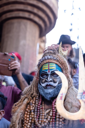 Varanasi, Uttar Pradesh, India - March 2023: Masan Holi, Portrait of an male artist with painted face act as lord shiva during the celebration of masaan holi at harishchandra ghat.のeditorial素材