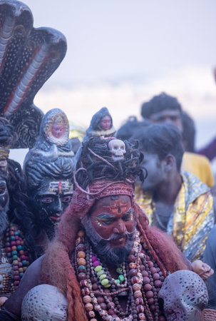 Varanasi, Uttar Pradesh, India - March 2023: Masan Holi, Portrait of an male artist with painted face act as lord shiva during the celebration of masaan holi at harishchandra ghat.のeditorial素材