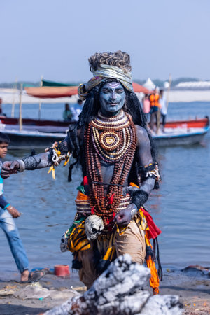 Varanasi, Uttar Pradesh, India - March 2023: Masan Holi, Portrait of an male artist with ash on face act as lord shiva during the celebration of masaan holi at harishchandra ghat.のeditorial素材