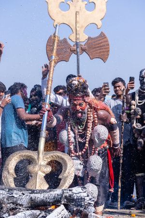 Varanasi, Uttar Pradesh, India - March 2023: Masan Holi, Portrait of an male artist with ash on face act as lord shiva during the celebration of masaan holi at harishchandra ghat.のeditorial素材