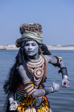 Varanasi, Uttar Pradesh, India - March 2023: Masan Holi, Portrait of an male artist with ash on face act as lord shiva during the celebration of masaan holi at harishchandra ghat.のeditorial素材