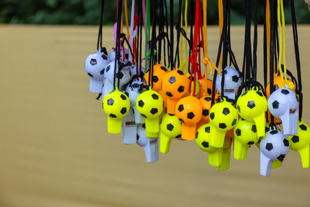 Colorful soccer balls hanging on a rope. Close-up.